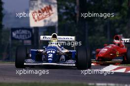 Ayrton Senna da Silva (BRA) Williams FW16 Renault leads Gerhard Berger (AUT) Ferrari 412T1 at Variante alta
