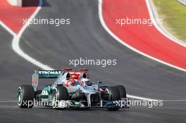 Michael Schumacher (GER) Mercedes AMG F1 W03 leads Jenson Button (GBR) McLaren MP4/27. 18.11.2012. Formula 1 World Championship, Rd 19, United States Grand Prix, Austin, Texas, USA, Race Day.
