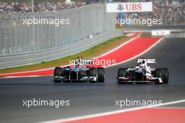 Michael Schumacher (GER) Mercedes AMG F1 W03 and Kamui Kobayashi (JPN) Sauber C31. 18.11.2012. Formula 1 World Championship, Rd 19, United States Grand Prix, Austin, Texas, USA, Race Day.