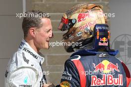 Michael Schumacher (GER), Mercedes AMG Petronas and pole for Sebastian Vettel (GER), Red Bull Racing  17.11.2012. Formula 1 World Championship, Rd 19, United States Grand Prix, Austin, USA, Qualifying Day