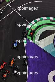 Max Verstappen (NLD) Red Bull Racing RB16B and Valtteri Bottas (FIN) Mercedes AMG F1 W12 battle for the lead of the race at the first restart. 05.12.2021. Formula 1 World Championship, Rd 21, Saudi Arabian Grand Prix, Jeddah, Saudi Arabia, Race Day.