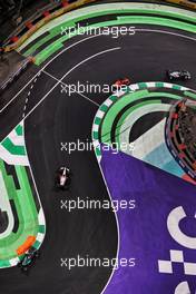 Yuki Tsunoda (JPN) AlphaTauri AT02 leads Carlos Sainz Jr (ESP) Ferrari SF-21 and Kimi Raikkonen (FIN) Alfa Romeo Racing C41. 05.12.2021. Formula 1 World Championship, Rd 21, Saudi Arabian Grand Prix, Jeddah, Saudi Arabia, Race Day.
