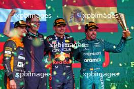 The podium (L to R): Lando Norris (GBR) McLaren, second; Jeff Calam (GBR) Red Bull Racing Senior Projects Engineer; Max Verstappen (NLD) Red Bull Racing, race winner; Fernando Alonso (ESP) Aston Martin F1 Team, third. 05.11.2023. Formula 1 World Championship, Rd 21, Brazilian Grand Prix, Sao Paulo, Brazil, Race Day.