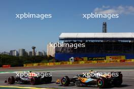 Max Verstappen (NLD) Red Bull Racing RB19 and Lando Norris (GBR) McLaren MCL60. 05.11.2023. Formula 1 World Championship, Rd 21, Brazilian Grand Prix, Sao Paulo, Brazil, Race Day.