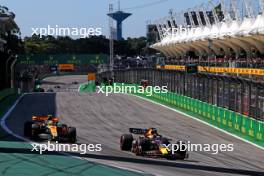 Max Verstappen (NLD) Red Bull Racing RB19 leads Lando Norris (GBR) McLaren MCL60. 05.11.2023. Formula 1 World Championship, Rd 21, Brazilian Grand Prix, Sao Paulo, Brazil, Race Day.