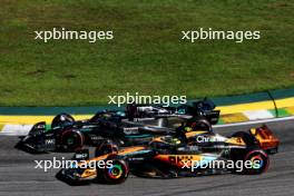 Lando Norris (GBR) McLaren MCL60 and George Russell (GBR) Mercedes AMG F1 W14 battle for position. 04.11.2023. Formula 1 World Championship, Rd 21, Brazilian Grand Prix, Sao Paulo, Brazil, Sprint Day.