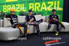 (L to R): Lando Norris (GBR) McLaren; Max Verstappen (NLD) Red Bull Racing; and Sergio Perez (MEX) Red Bull Racing, in the post Sprint FIA Press Conference. 04.11.2023. Formula 1 World Championship, Rd 21, Brazilian Grand Prix, Sao Paulo, Brazil, Sprint Day.
