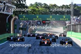 (L to R): Lando Norris (GBR) McLaren MCL60 and Max Verstappen (NLD) Red Bull Racing RB19 lead at the start of Sprint. 04.11.2023. Formula 1 World Championship, Rd 21, Brazilian Grand Prix, Sao Paulo, Brazil, Sprint Day.