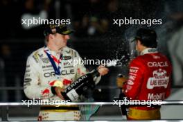 (L to R): Race winner Max Verstappen (NLD) Red Bull Racing celebrates on the podium with third placed team mate Sergio Perez (MEX) Red Bull Racing. 18.11.2023. Formula 1 World Championship, Rd 22, Las Vegas Grand Prix, Las Vegas, Nevada, USA, Race Day.