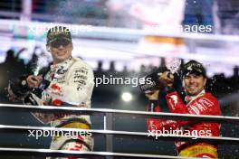 (L to R): Race winner Max Verstappen (NLD) Red Bull Racing celebrates on the podium with third placed Sergio Perez (MEX) Red Bull Racing. 18.11.2023. Formula 1 World Championship, Rd 22, Las Vegas Grand Prix, Las Vegas, Nevada, USA, Race Day.