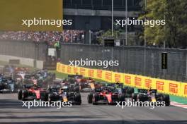 (L to R): Max Verstappen (NLD) Red Bull Racing RB19; Charles Leclerc (MON) Ferrari SF-23; and Sergio Perez (MEX) Red Bull Racing RB19 at the start of the race. 29.10.2023. Formula 1 World Championship, Rd 20, Mexican Grand Prix, Mexico City, Mexico, Race Day.