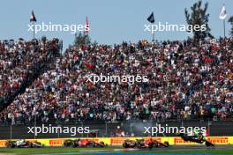 Sergio Perez (MEX) Red Bull Racing RB19 is launched into the air after contact with Charles Leclerc (MON) Ferrari SF-23 at the start of the race. 29.10.2023. Formula 1 World Championship, Rd 20, Mexican Grand Prix, Mexico City, Mexico, Race Day.