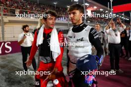 (L to R): Charles Leclerc (MON) Ferrari with Pierre Gasly (FRA) Alpine F1 Team on the grid. 08.10.2023. Formula 1 World Championship, Rd 18, Qatar Grand Prix, Doha, Qatar, Race Day.