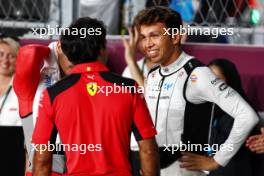 (L to R): Carlos Sainz Jr (ESP) Ferrari with Alexander Albon (THA) Williams Racing on the grid. 08.10.2023. Formula 1 World Championship, Rd 18, Qatar Grand Prix, Doha, Qatar, Race Day.