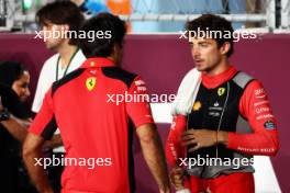 (L to R): Carlos Sainz Jr (ESP) Ferrari with Charles Leclerc (MON) Ferrari on the grid. 08.10.2023. Formula 1 World Championship, Rd 18, Qatar Grand Prix, Doha, Qatar, Race Day.