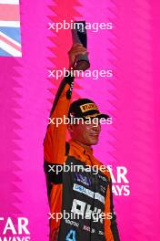 Lando Norris (GBR) McLaren celebrates his third position on the podium. 08.10.2023. Formula 1 World Championship, Rd 18, Qatar Grand Prix, Doha, Qatar, Race Day.
