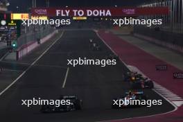 George Russell (GBR) Mercedes AMG F1 W14 and Logan Sargeant (USA) Williams Racing FW45 battle for position. 08.10.2023. Formula 1 World Championship, Rd 18, Qatar Grand Prix, Doha, Qatar, Race Day.
