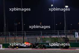 Sergio Perez (MEX) Red Bull Racing RB19 and Lewis Hamilton (GBR) Mercedes AMG F1 W14. 07.10.2023. Formula 1 World Championship, Rd 18, Qatar Grand Prix, Doha, Qatar, Sprint Day.