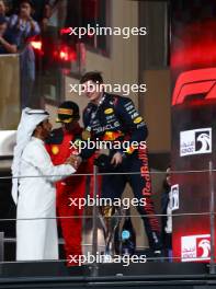 Race winner Max Verstappen (NLD) Red Bull Racing celebrates on the podium with Mohammed Bin Sulayem (UAE) FIA President. 26.11.2023. Formula 1 World Championship, Rd 23, Abu Dhabi Grand Prix, Yas Marina Circuit, Abu Dhabi, Race Day.