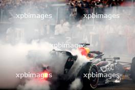 Race winner Max Verstappen (NLD) Red Bull Racing RB19 celebrates with doughnuts at the end of the race in parc ferme. 26.11.2023. Formula 1 World Championship, Rd 23, Abu Dhabi Grand Prix, Yas Marina Circuit, Abu Dhabi, Race Day.