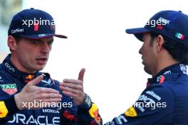 (L to R): Max Verstappen (NLD) Red Bull Racing and Sergio Perez (MEX) Red Bull Racing at a team photograph. 26.11.2023. Formula 1 World Championship, Rd 23, Abu Dhabi Grand Prix, Yas Marina Circuit, Abu Dhabi, Race Day.