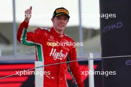 Frederik Vesti (DEN) Prema Racing celebrates his third position on the podium. 26.11.2023. Formula 2 Championship, Rd 14, Yas Marina Circuit, Abu Dhabi, UAE, Feature Race, Sunday.