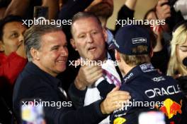 Race winner Max Verstappen (NLD) Red Bull Racing celebrates in parc ferme with Raymond Vermeulen (NLD) Driver Manager and father Jos Verstappen (NLD). 02.03.2024. Formula 1 World Championship, Rd 1, Bahrain Grand Prix, Sakhir, Bahrain, Race Day.