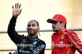 (L to R): Lewis Hamilton (GBR) Mercedes AMG F1 with Charles Leclerc (MON) Ferrari on the drivers' parade. 02.03.2024. Formula 1 World Championship, Rd 1, Bahrain Grand Prix, Sakhir, Bahrain, Race Day.