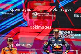 (L to R): Lando Norris (GBR) McLaren and race winner Max Verstappen (NLD) Red Bull Racing on the podium. 21.04.2024. Formula 1 World Championship, Rd 5, Chinese Grand Prix, Shanghai, China, Race Day.