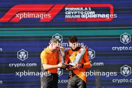 (L to R): Andrea Stella (ITA) McLaren Team Principal celebrates with race winner Lando Norris (GBR) McLaren on the podium. 05.05.2024. Formula 1 World Championship, Rd 6, Miami Grand Prix, Miami, Florida, USA, Race Day.