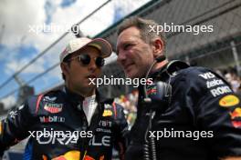 (L to R): Sergio Perez (MEX) Red Bull Racing with Christian Horner (GBR) Red Bull Racing Team Principal on the grid. 04.05.2024. Formula 1 World Championship, Rd 6, Miami Grand Prix, Miami, Florida, USA, Sprint and Qualifying Day.