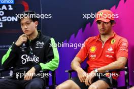 (L to R): Zhou Guanyu (CHN) Sauber and Carlos Sainz Jr (ESP) Ferrari in the FIA Press Conference. 21.02.2024. Formula 1 Testing, Sakhir, Bahrain, Day One.